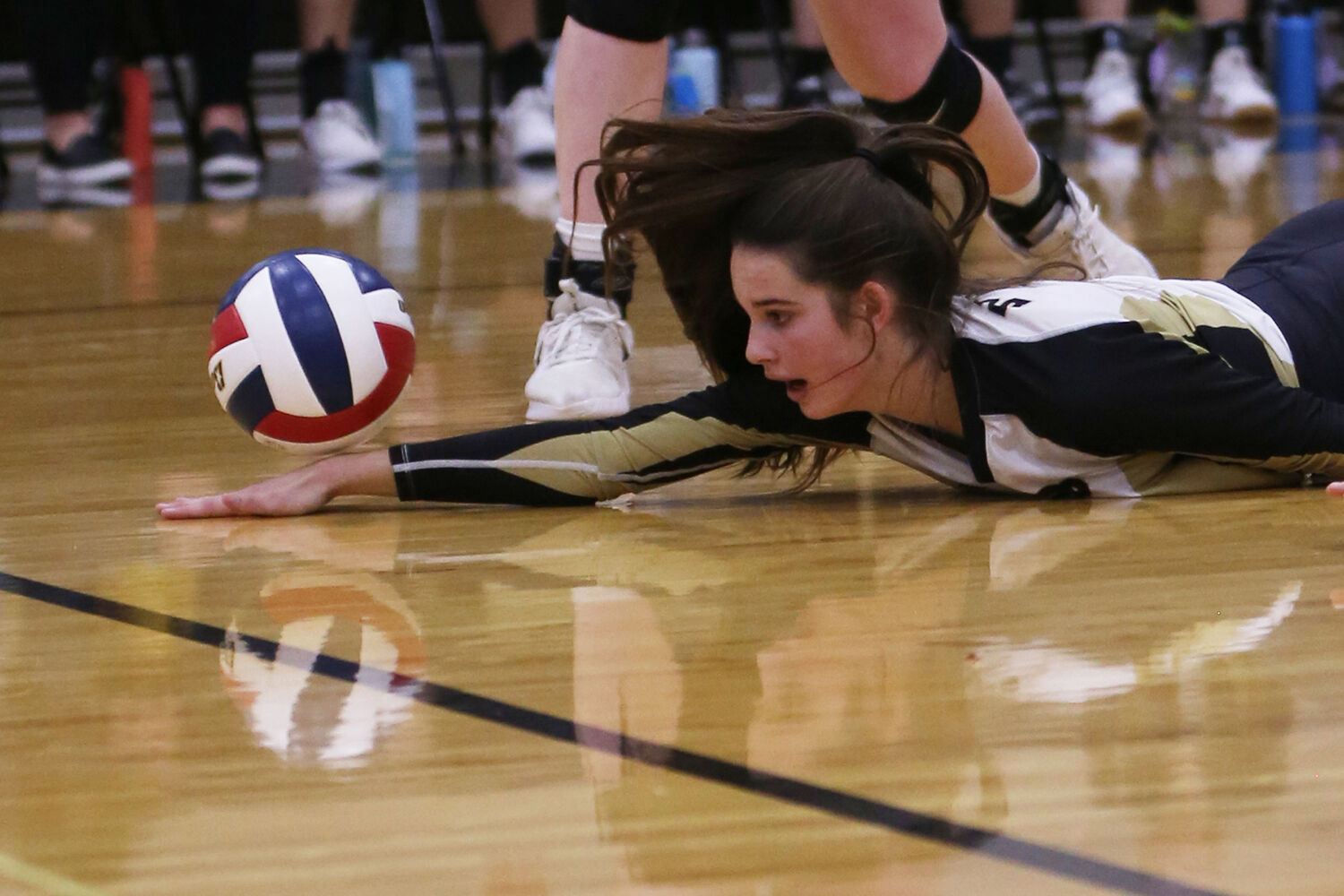 Cassidy Bessler dives in an attempt to recover